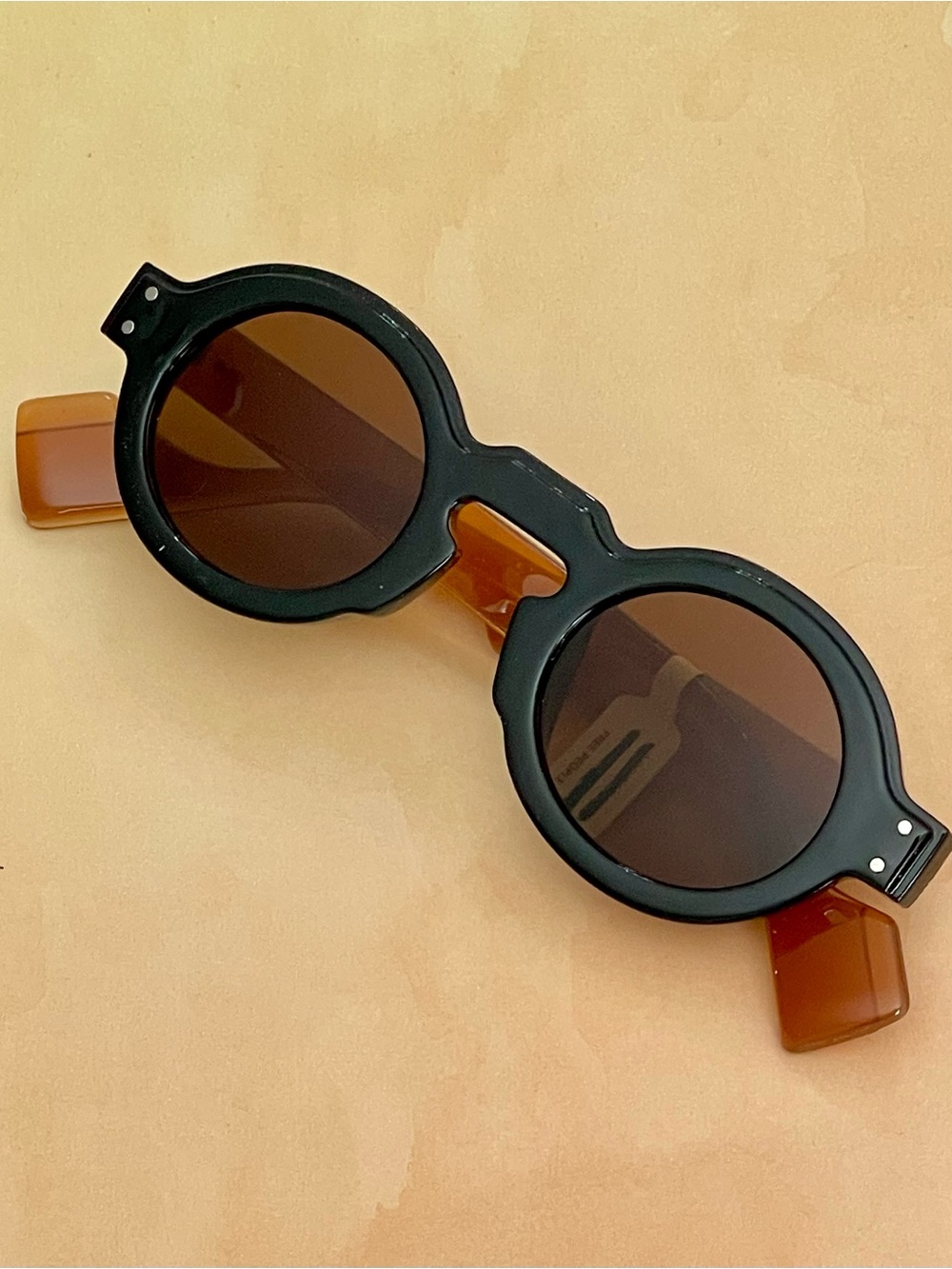 Free People Round Two-Tone Sunglasses in Black and Amber with Brown Lenses
